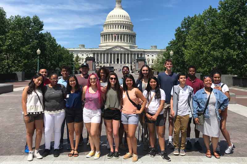 Students from the Nebraska Civic Leadership Program pose in front of the U.S. Capitol Building