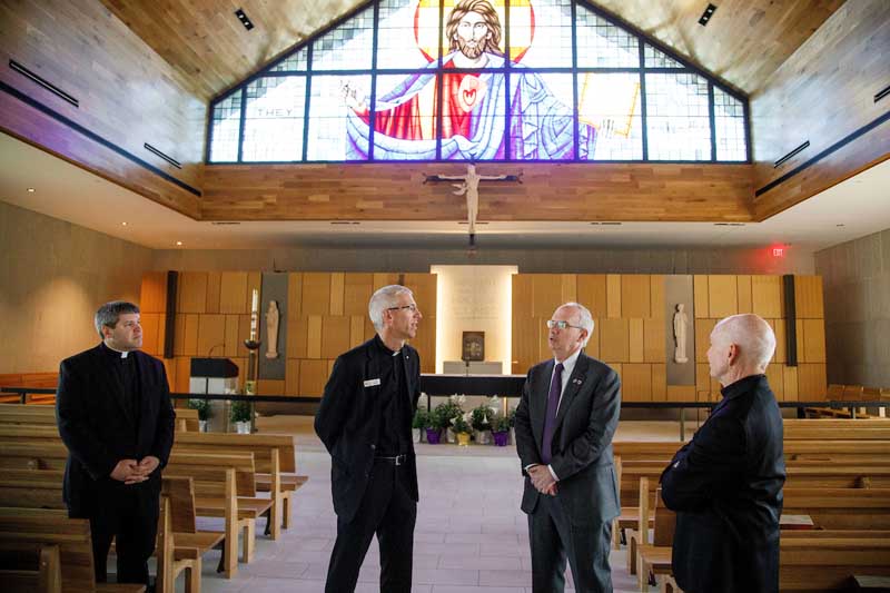 Fr. Taphorn and Chancellor Gold speak at the rectory during a tour