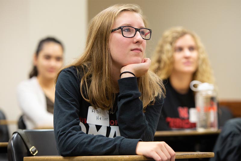 Senior Abi Heller listens to a discussion during a Common Reader Experience event at UNO