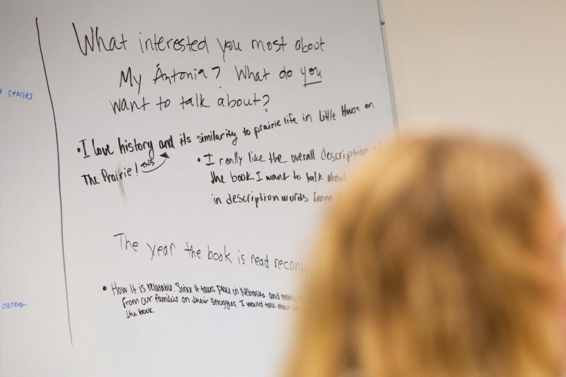 A white board with notes on student reactions to reading "My Antonia"