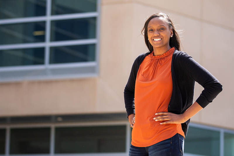 UNO student Tiffany Hunter stands in front of Mammel Hall