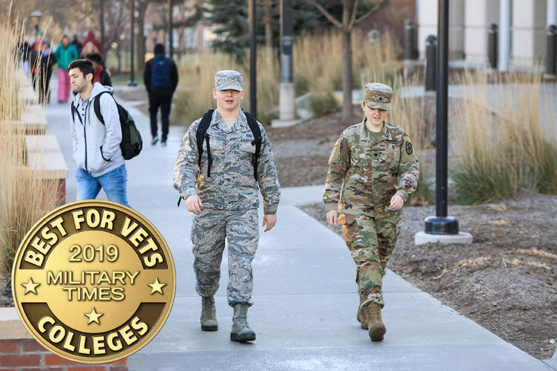 UNO students Nate Dunning (Nebraska Air National Guard) and Murrin McCausland (Army Reserve) walk along UNO's Dodge Campus.