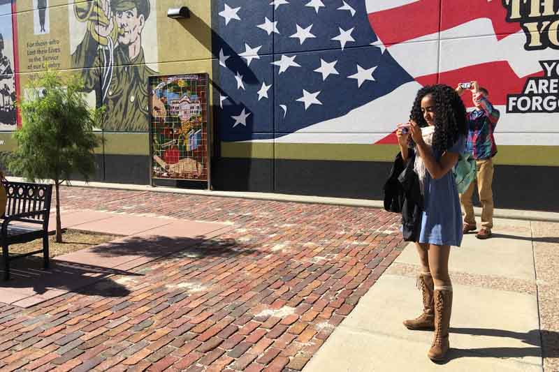 UNO student Kylie Kight takes photos in Nebraska City as part of Jeremy Lipschultz's Social Media Measurement and Management course