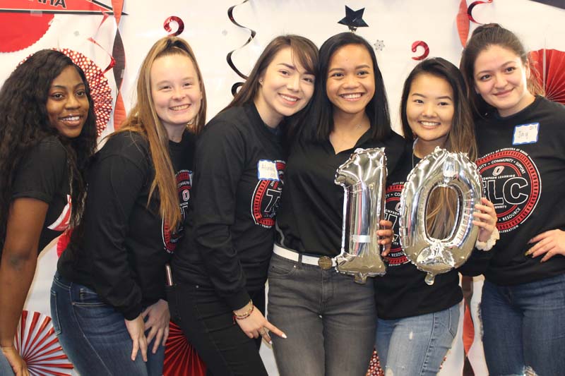 Students pose for a photo at the TLC anniversary celebration