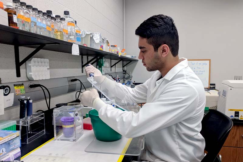 UNO student Bejan Mahmud conducts research in a campus lab