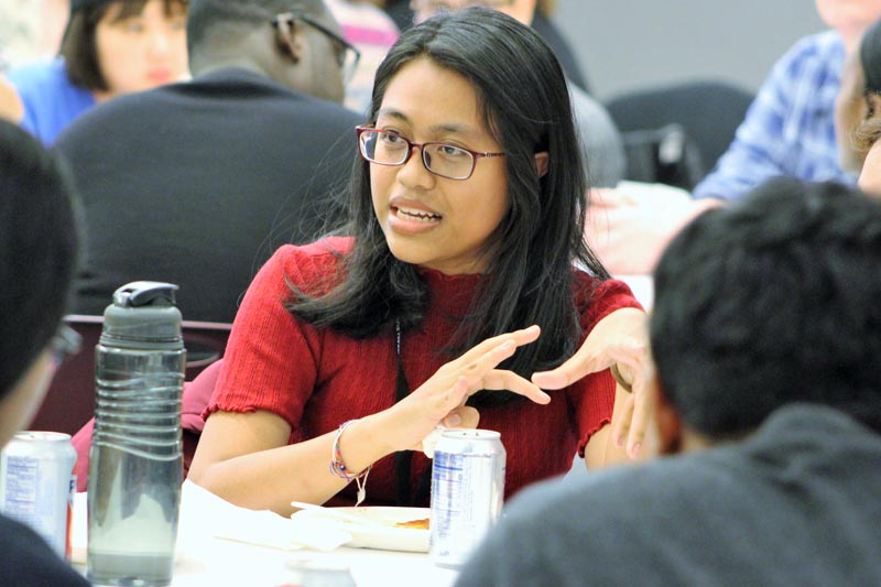 Participants engage in a discussion during a roundtable talk at a Sustained Dialogue event