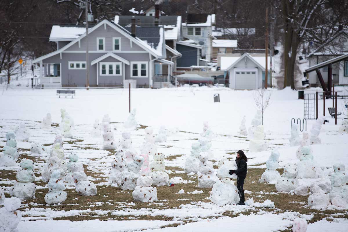 Alec Paul Johnson creates his "Love Army" of snowmen in Leavenworth Park