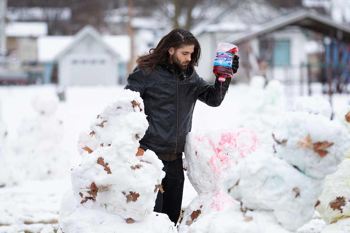 Alec Paul Johnson creates his "Love Army" of snowmen in Leavenworth Park