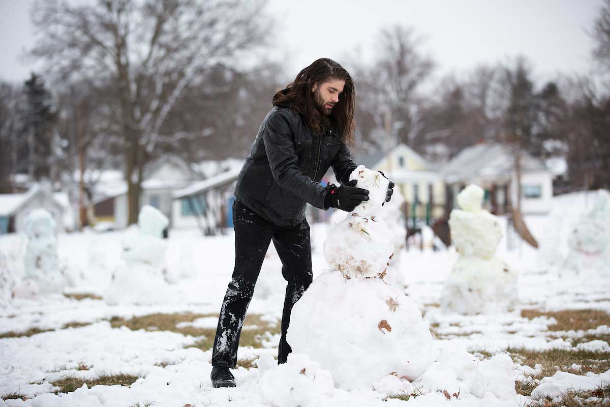 Alec Paul Johnson creates his "Love Army" of snowmen in Leavenworth Park