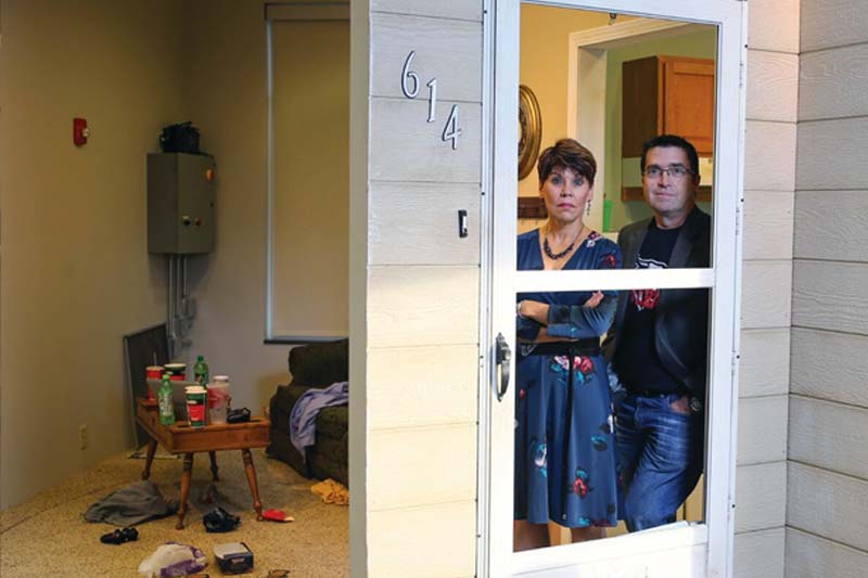 Deb Anderson and Steven Williams stand in one of the sets designed to train social workers from Project Harmony