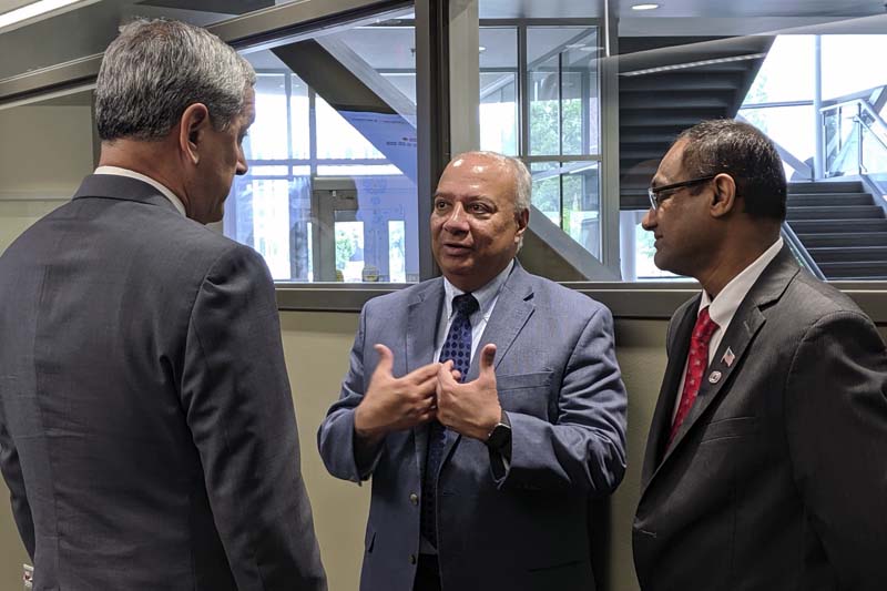 DPAA Director Kelly McKeague meets with UNO professor Sachin Pawaskar and UNO College of Information Science and Technology Dean Hesham Ali