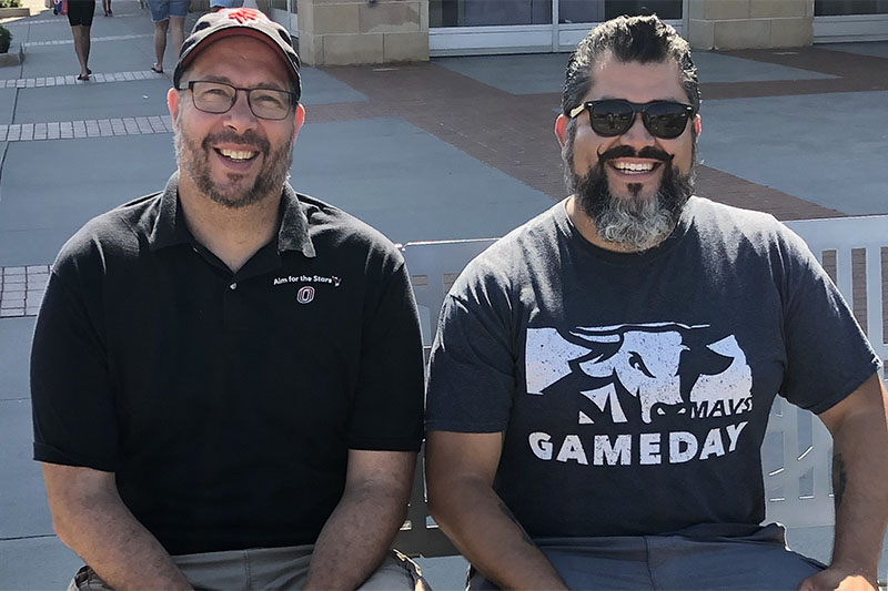 Doug Showell (left) and Anthony Galdamez provided educational hands-on activities related to lunar exploration at an Omaha Storm Chasers game.
