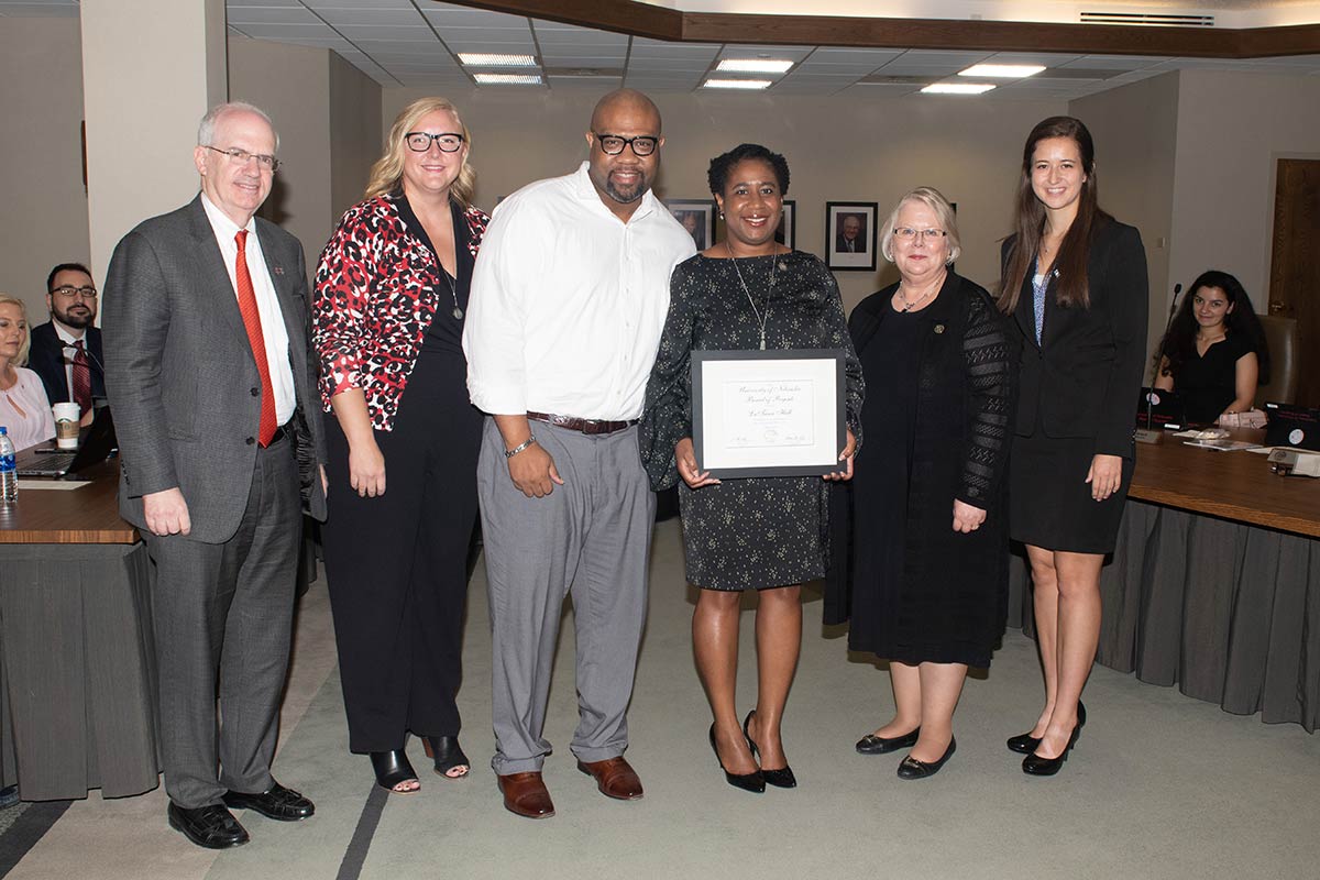 LaTrina Parker poses with the KUDOS Award