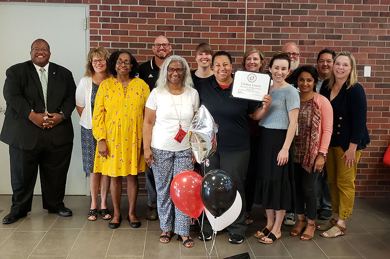 Lindsay Linson with co-workers and the Celebration Committee