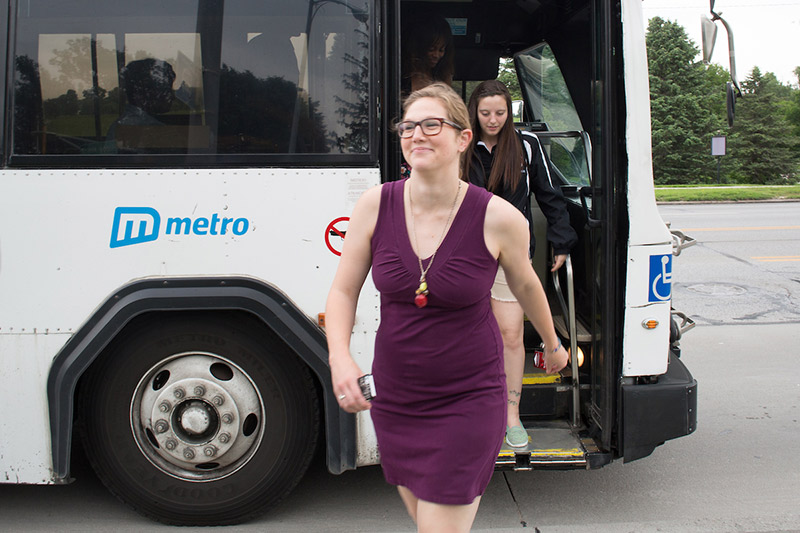 Students stepping off a Metro bus