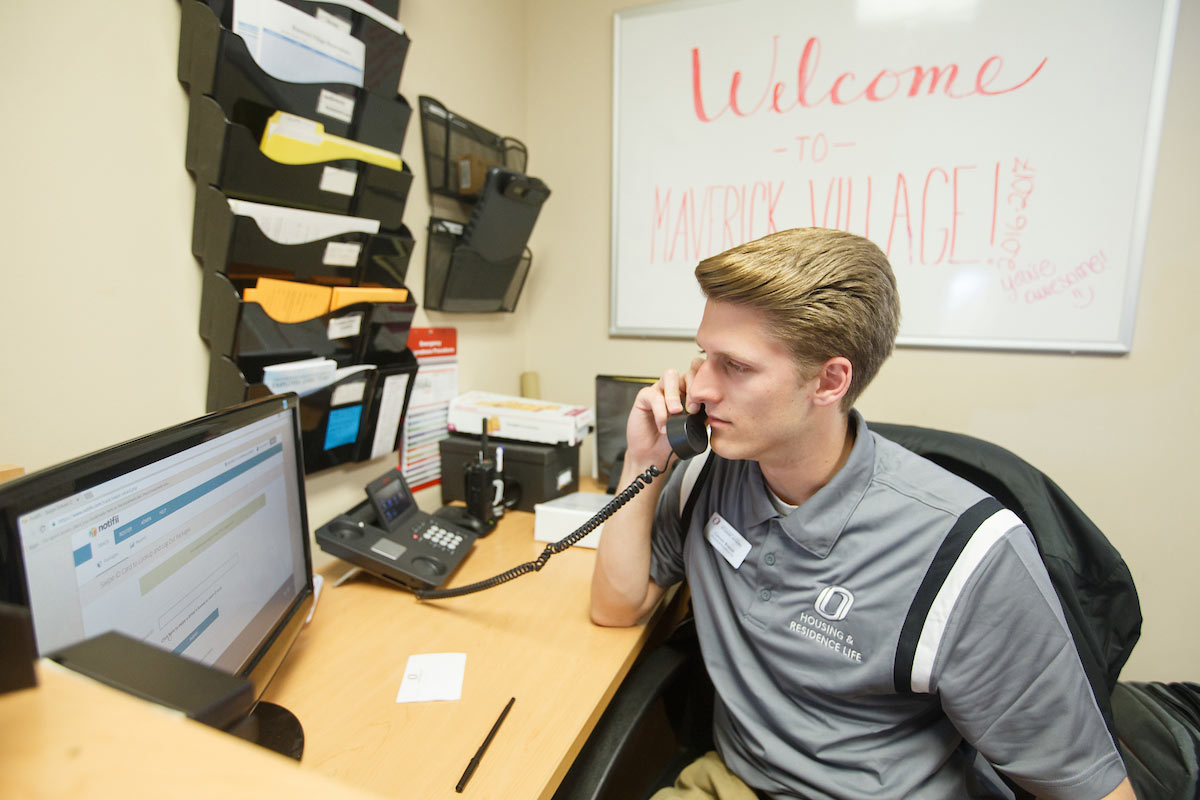 A student worker talking on the phone
