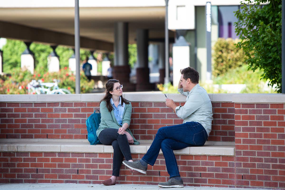 Students talking near the Campanile