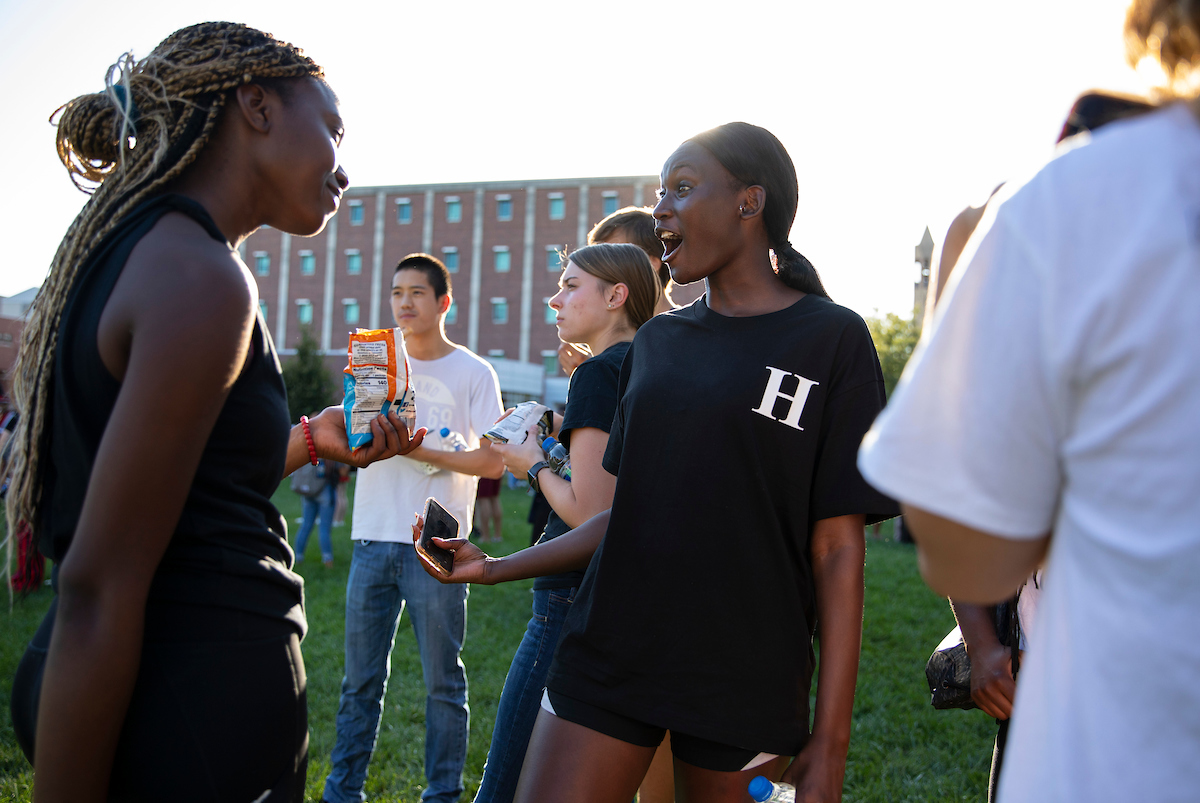 Two students have fun during the First Generation Proud pre-game event