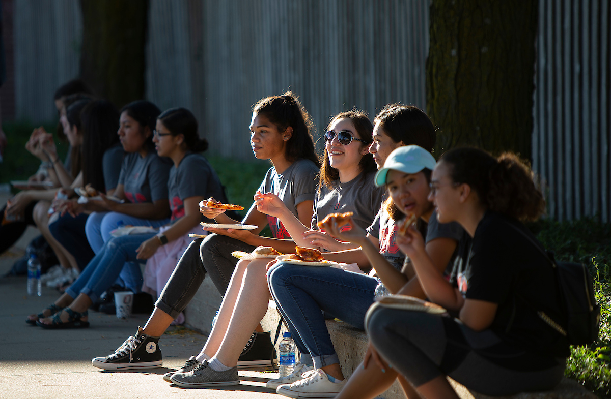 First generation students at UNO talk over pizza