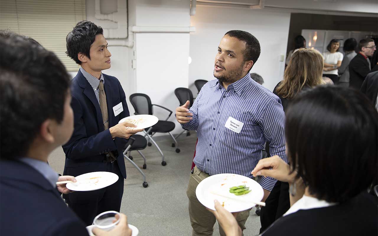 UNO alumni converse at an alumni event held in Tokyo