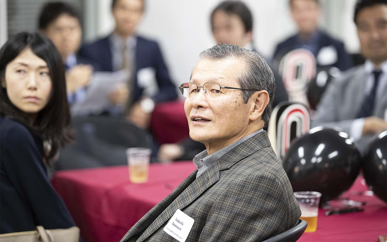Alumni listen to Chancellor Gold speak at an alumni event held in Tokyo