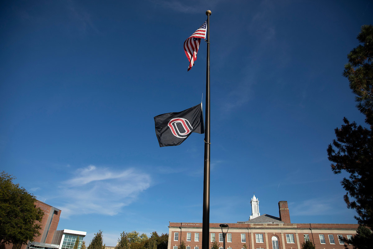 UNO flag lowered outside the pep bowl