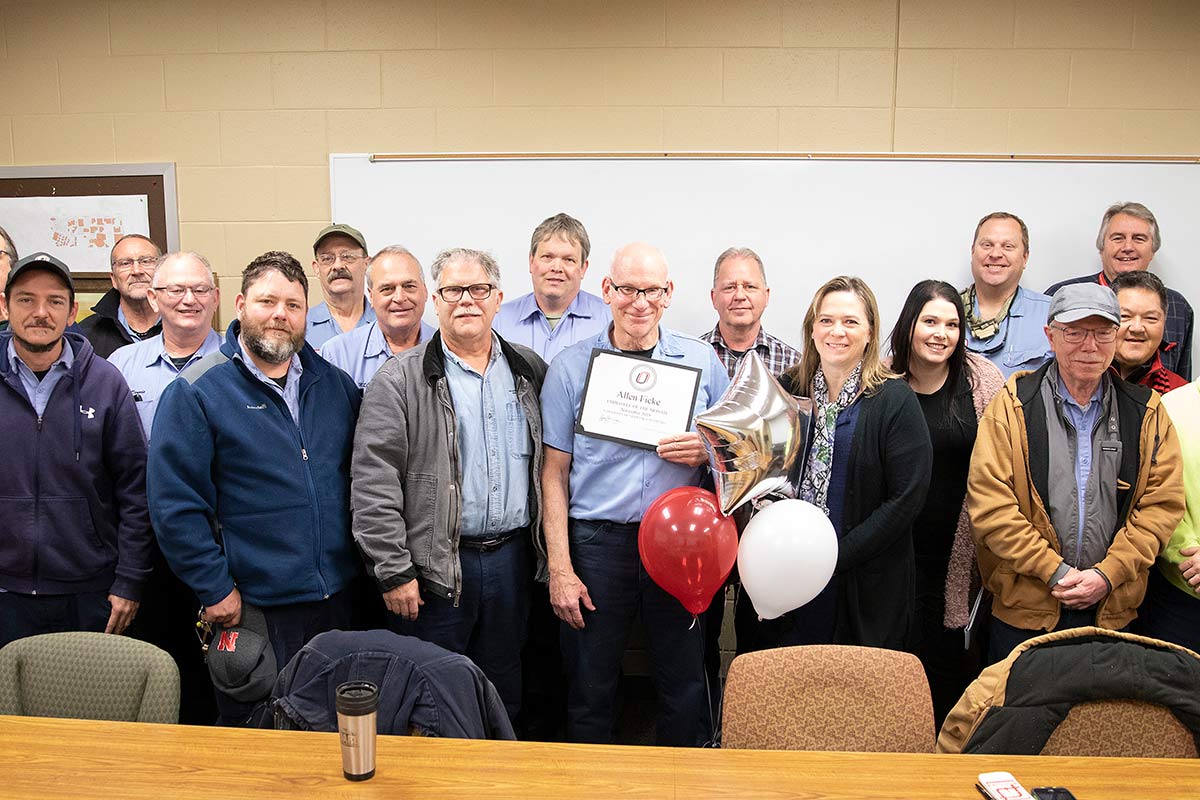 The Celebration Committee presents Allen Ficke with Employee of the Month