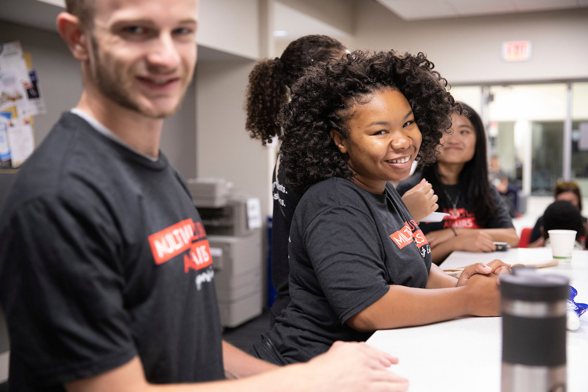 Students assist at a Multicultural Affairs event