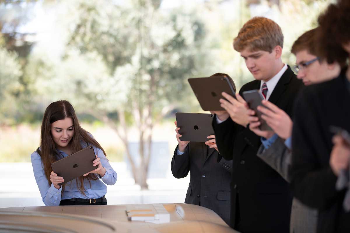 Gwyneth Semanisin gets a better view using a virtual reality program on iPads to bring an interactive model of Apple Park to life at the Apple Visitor Center in Cupertino, California