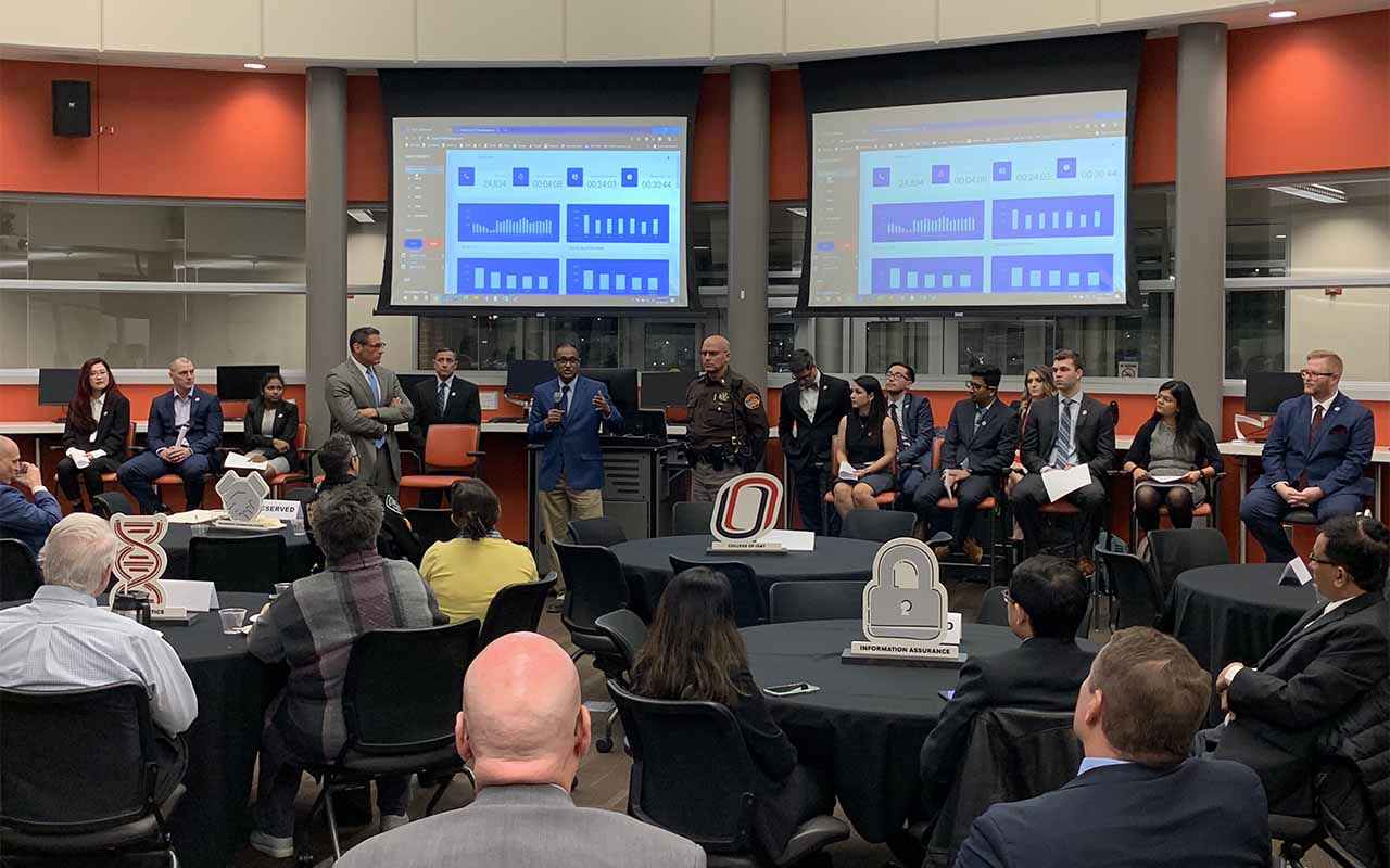 Students and faculty from UNO's College of Information Science & Technology (IS&T) present the dashboard to Sarpy County law enforcement personnel.