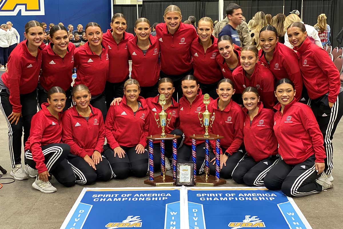 UNO Dance Team poses with trophies