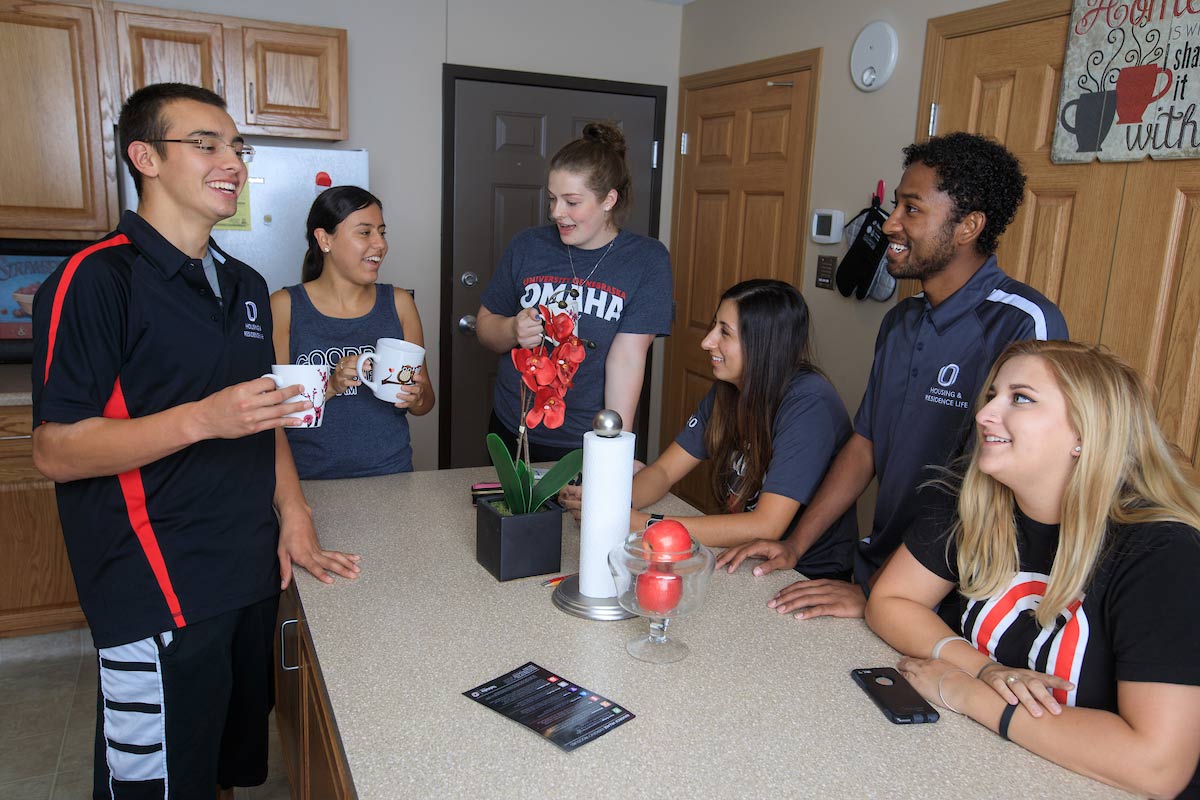 Students talking in a dorm.