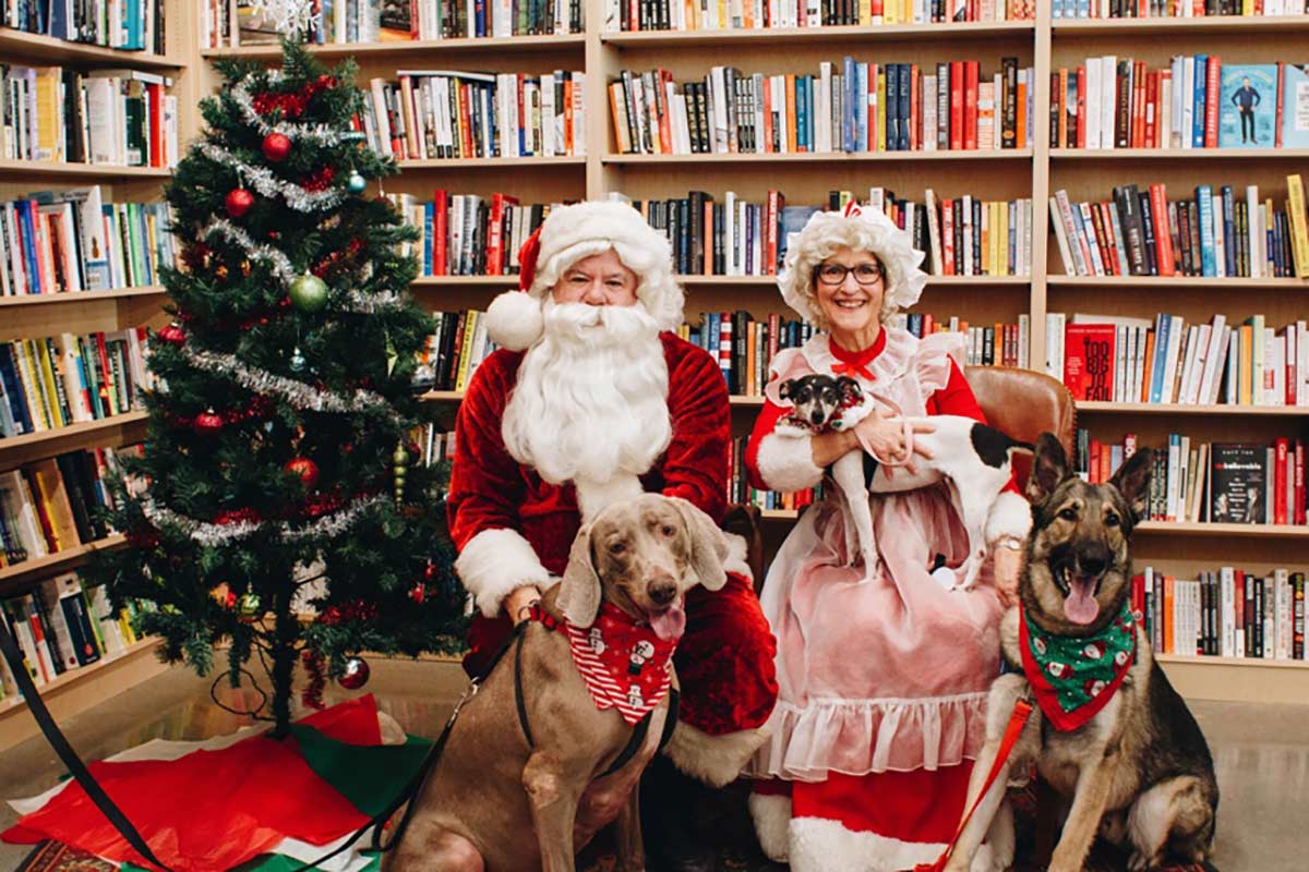 Mr. and Mrs. Claus pose with dogs