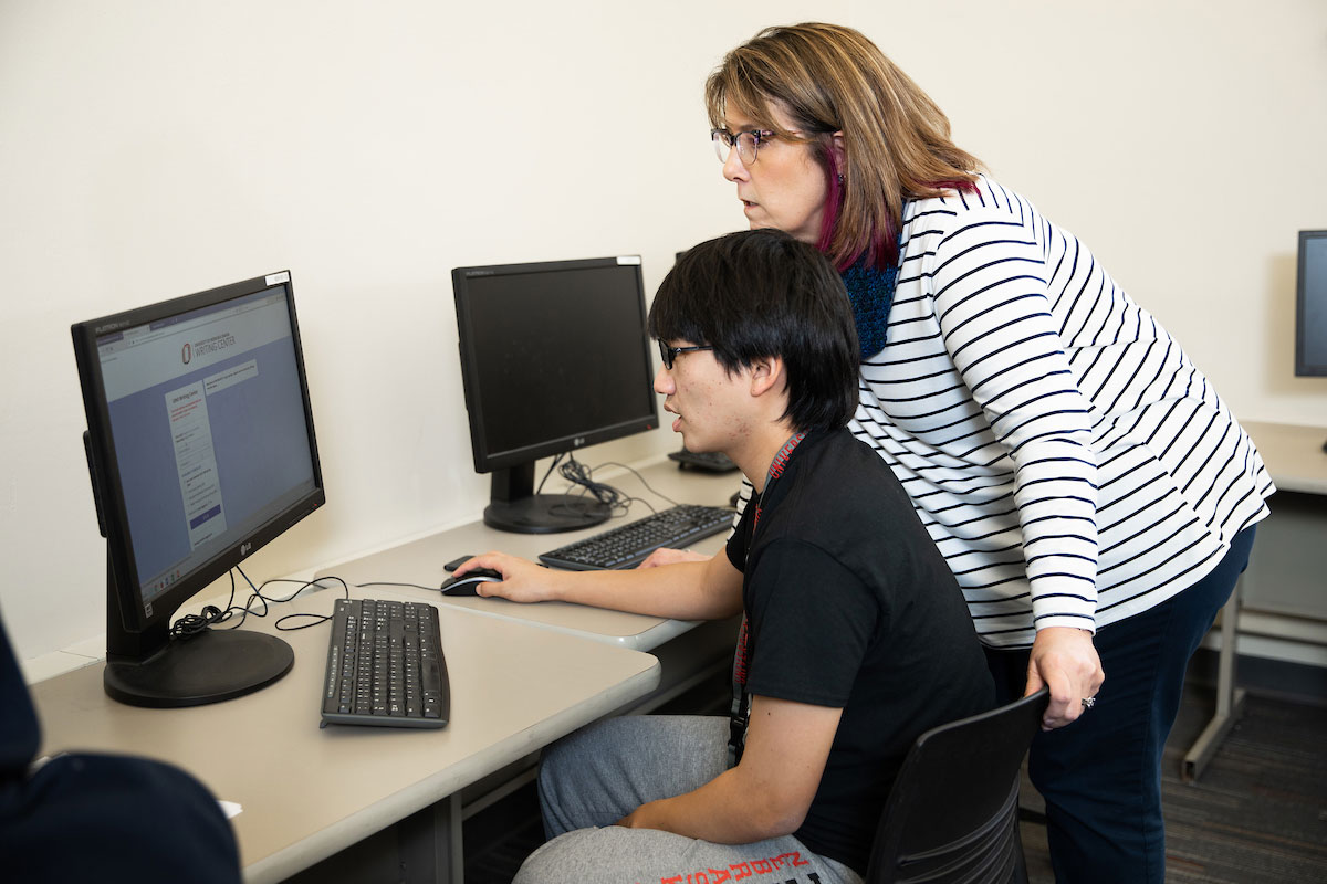 Kathy Radosta, right, works with student Kenshiro Tanaka.