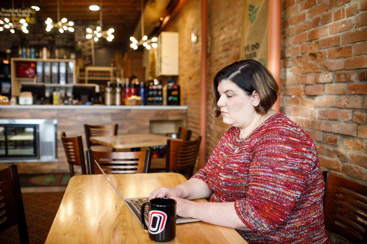 BMS student Shanna Wright studies with her laptop at a coffee shop in Norfolk, Neb.
