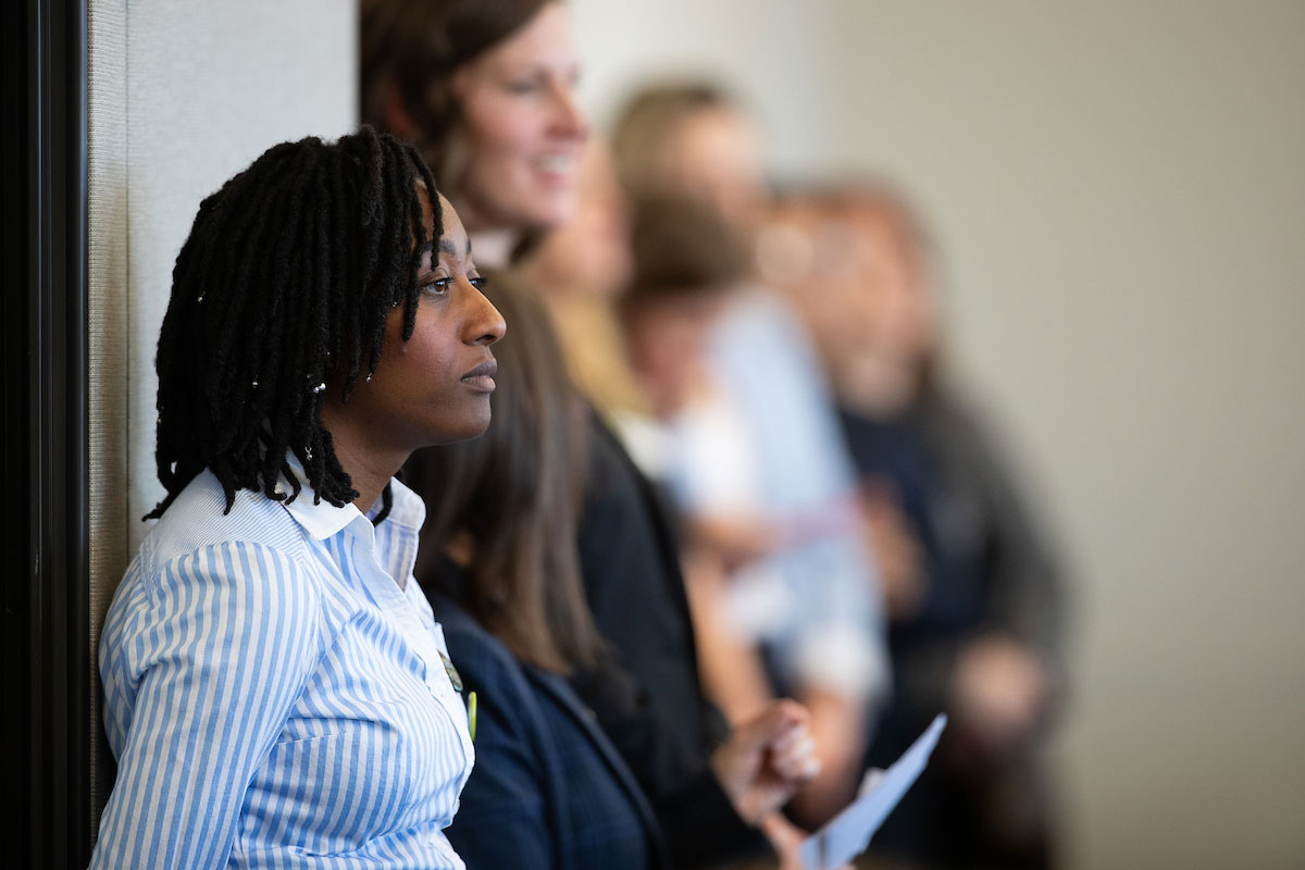 A guest at the Women's Policy Forum listens to the presenters.