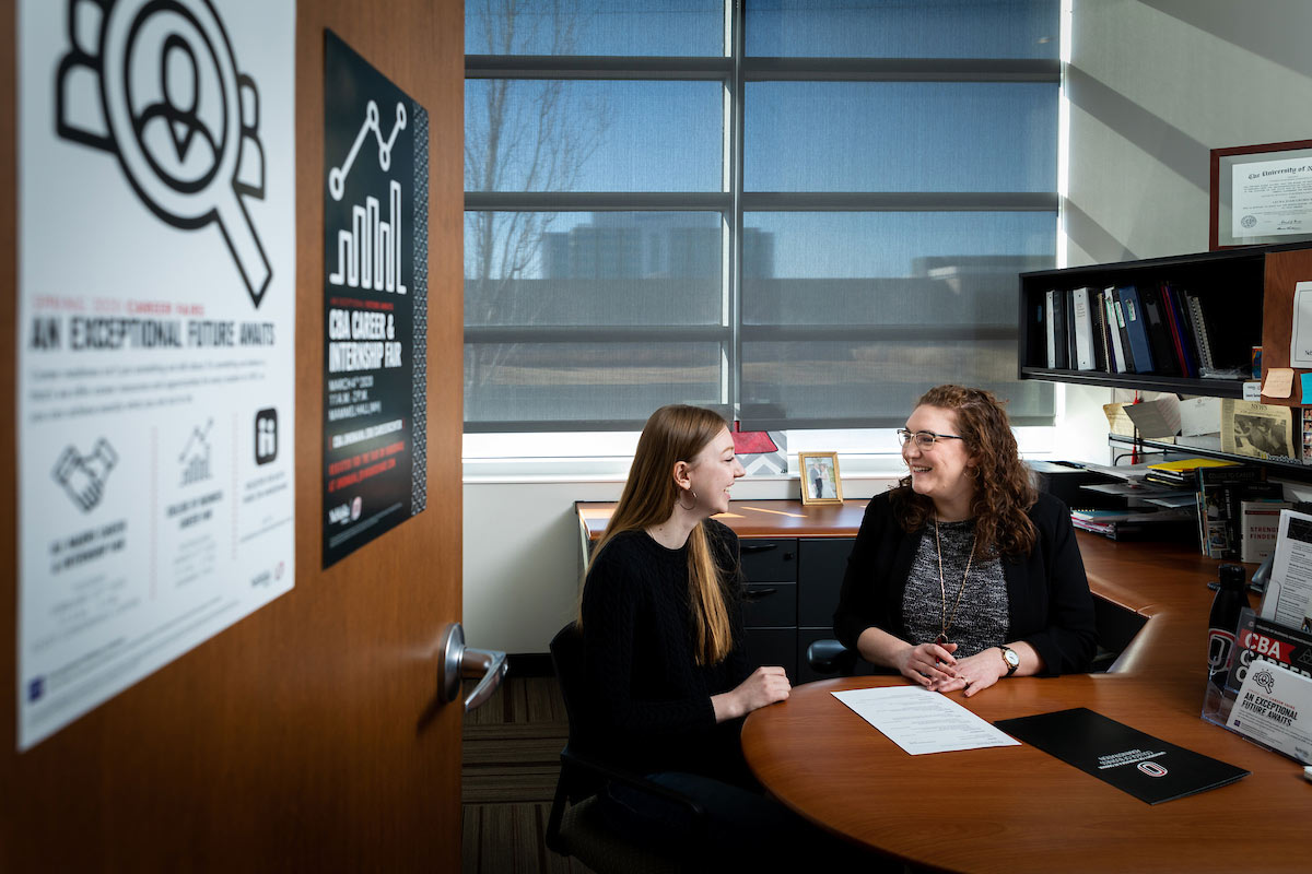 An advisor talking to a student