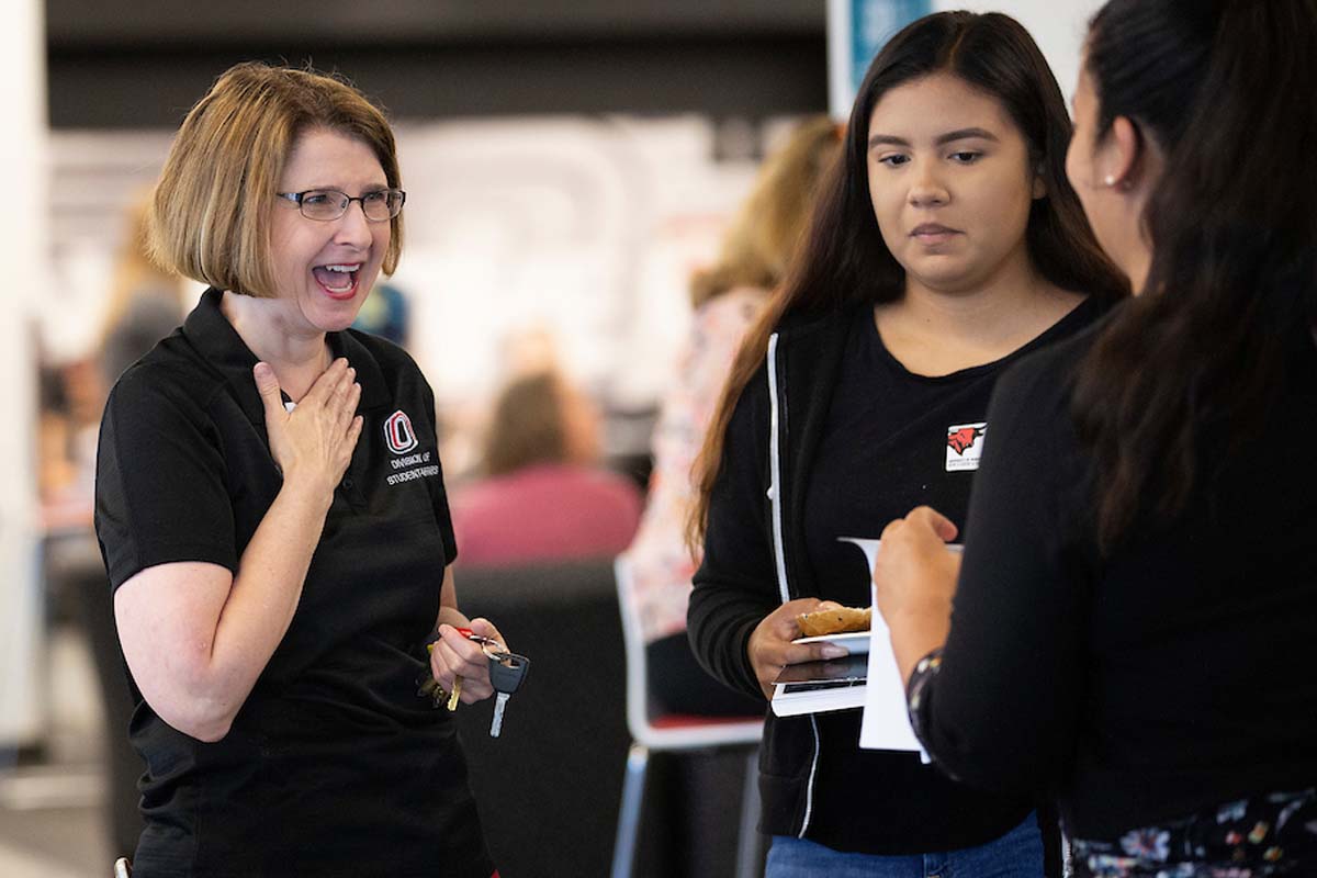 Cathy Pettid laughs with students.