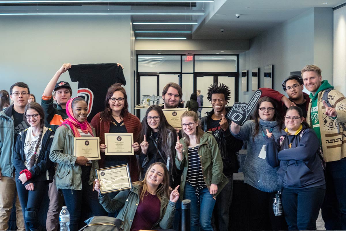 Students pose with awards