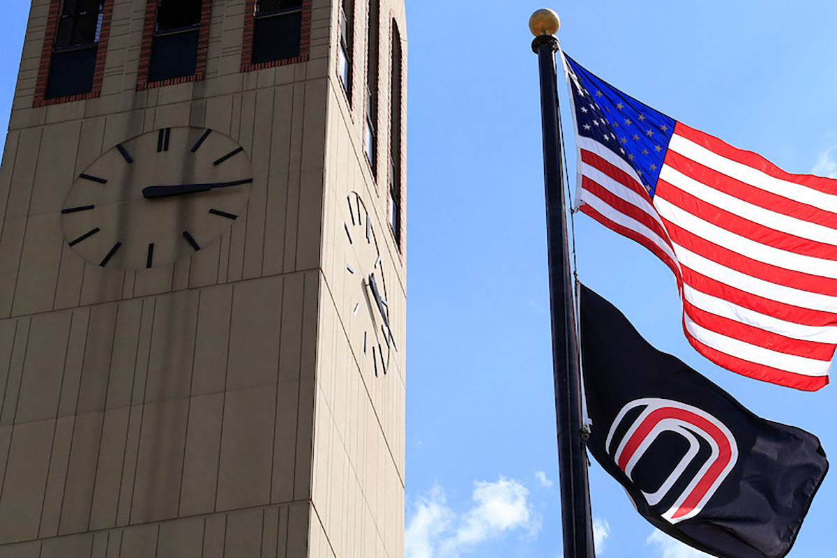 U.S. and UNO Flags hanging beside the Campanile