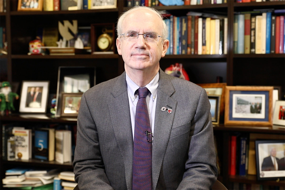 Chancellor Gold sits in his office, looking at the camera.