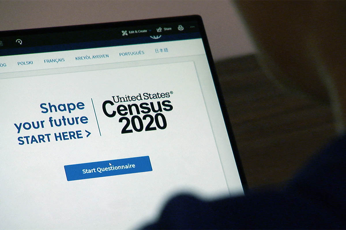 A Census respondent completes the 2020 Census on a laptop.