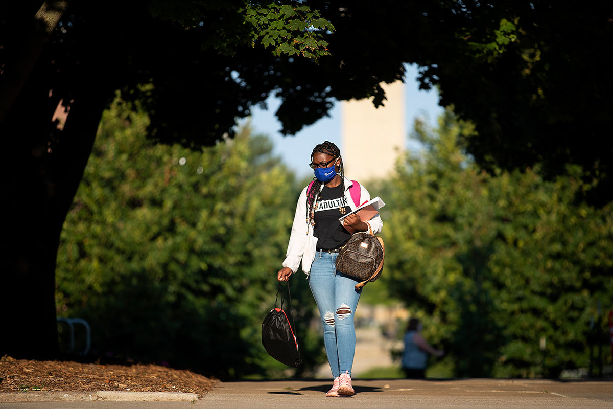 student walking on campus