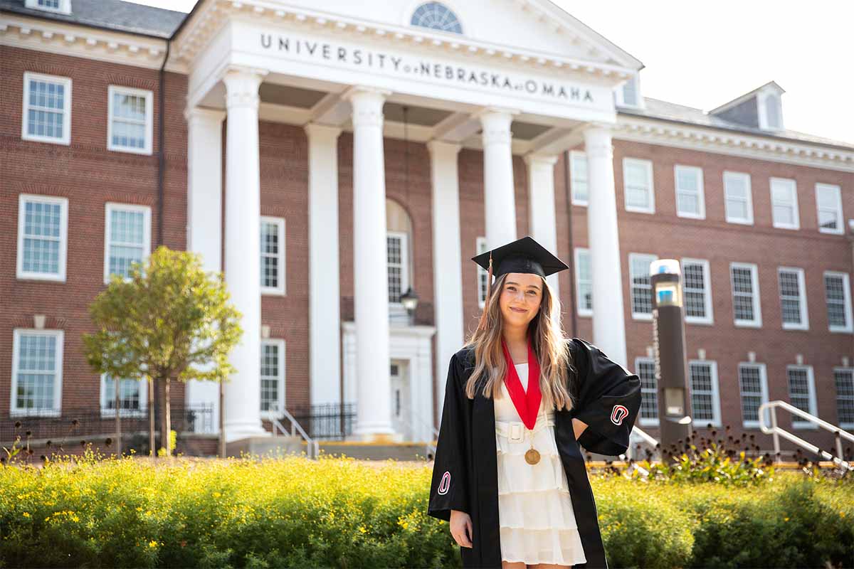 Sydney Peatrowsky, pictured here in front of Arts and Sciences Hall, graduated from UNO in August 2020 with a degree in Business Administration.