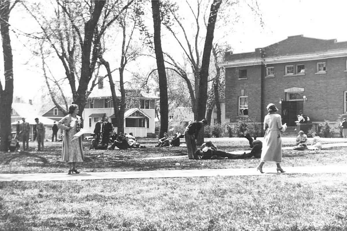 Two students walk past each other on the OU campus in North Omaha