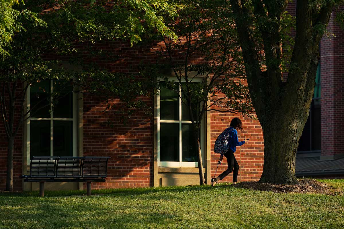 student walking on campus