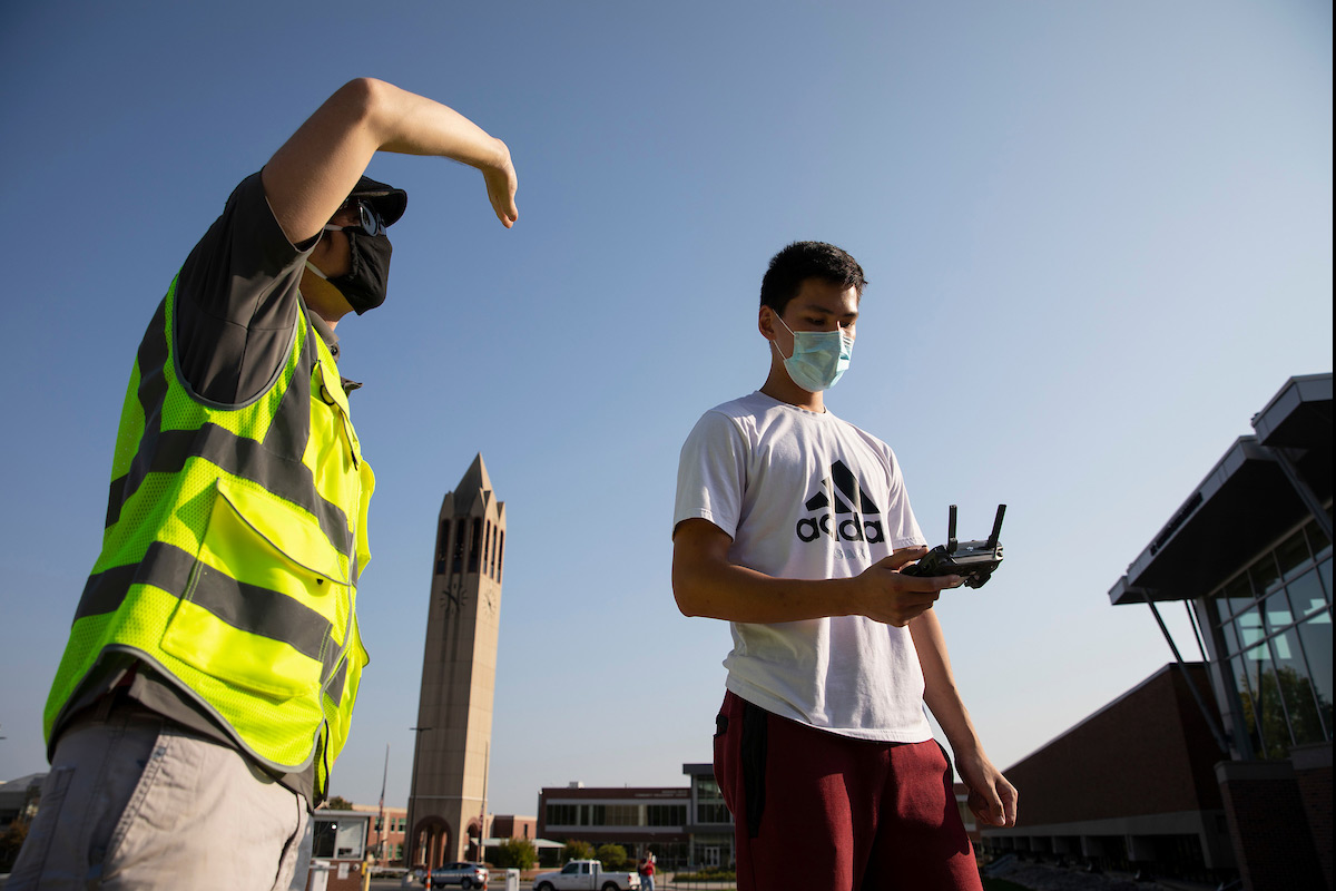 UNO Aviation Institute students John Koch, left, and Jason Chan record photos and video with a drone over campus at the University of Nebraska at Omaha