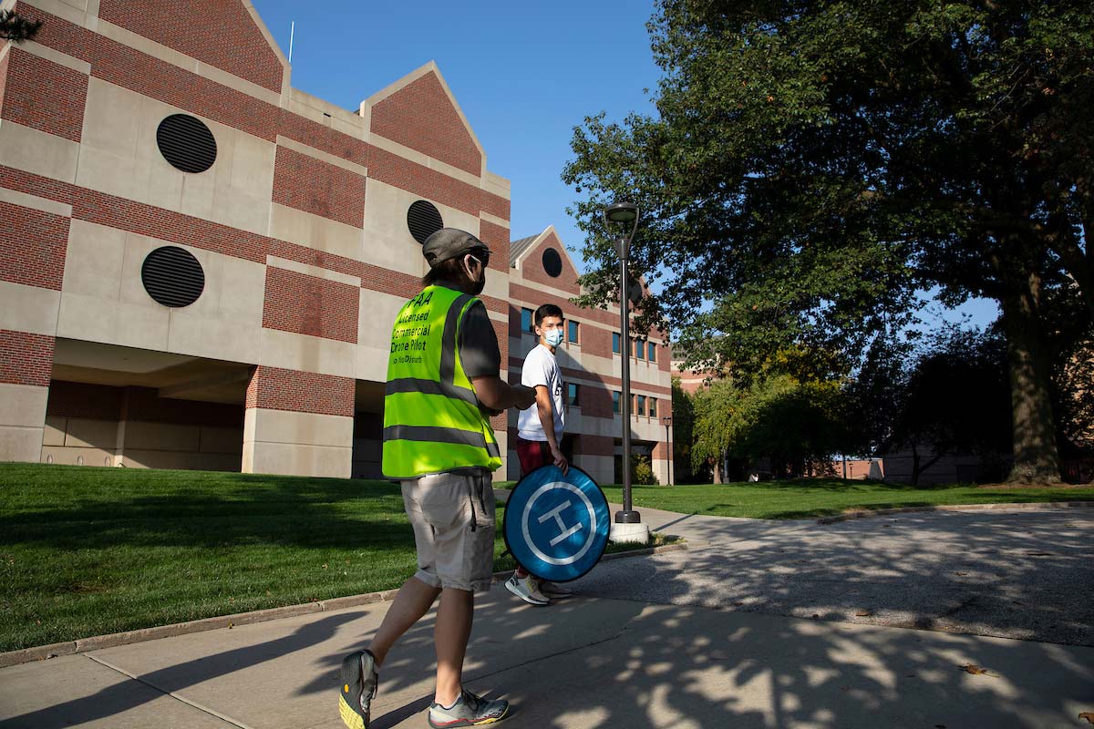 UNO Aviation Institute students John Koch, left, and Jason Chan record photos and video with a drone over campus at the University of Nebraska at Omaha