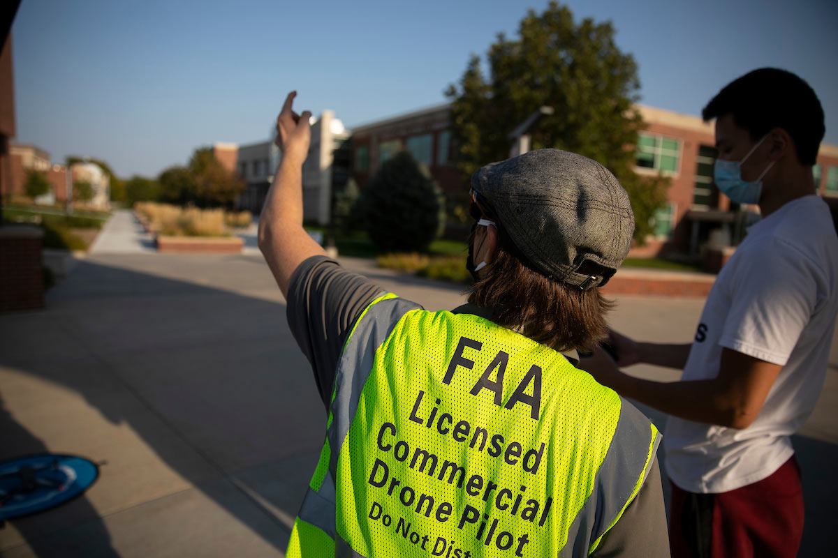 UNO Aviation Institute students John Koch, left, and Jason Chan record photos and video with a drone over campus at the University of Nebraska at Omaha