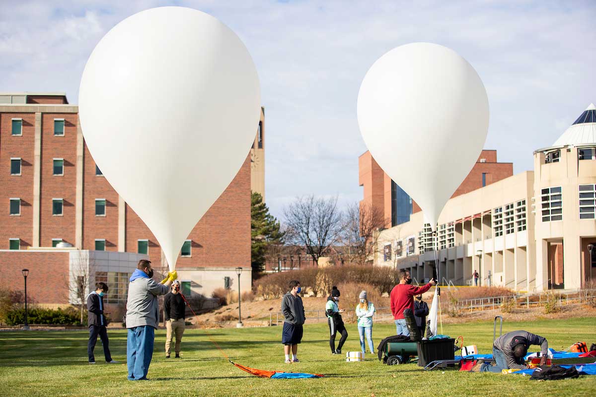 Two teams of students from UNO’s Thompson Learning Community and Exploratory Studies programs in launching two high-altitude balloons from the Pep Bowl on UNO’s Dodge Campus on Friday, Nov. 20, 2020.